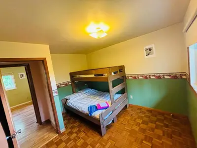 a bedroom with a bunk bed in a room at Charming Farmhouse in Grafton