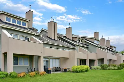 an exterior view of a large building with grass at Wintergreen 122 in Blue Mountains