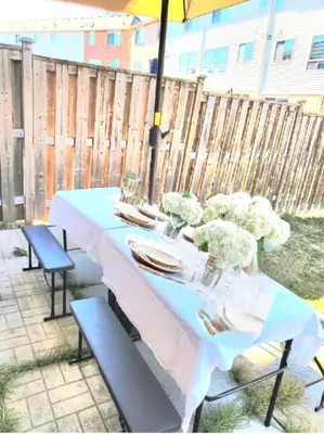 a table with a blue table cloth on a patio at The Mt Pleasant Residence - 'Your Cozy Away-Home' in Brampton