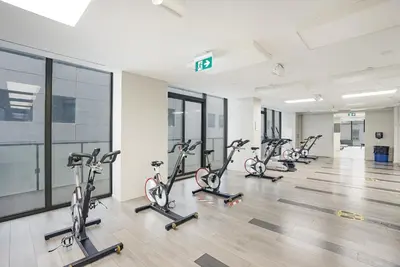 a row of exercise bikes in a gym at The Aventi Suites - Downtown Toronto - Across TIFF Bell Lightbox in Toronto