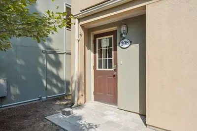 a door to a house with a speed limit sign on it at Wintergreen Spacious 2 Story Townhome Sauna 2 Min Walk to Village in Blue Mountains