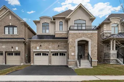 a house with two garage doors in front of it at Modern Comfort in Clarington in Newcastle
