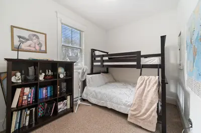 a bedroom with a bunk bed and a book shelf at The Cardinal - 7 Hollow in Cherry Valley