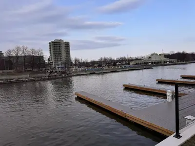 a river with a dock in the middle of it at Steps to Bars & Fun in Port Credit in Mississauga
