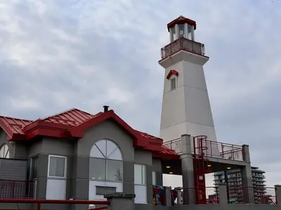 a building with a lighthouse on top of it at Steps to Bars & Fun in Port Credit in Mississauga