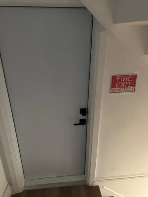 a white door with a fire department sign on it at Comfortable place In An Amazing Location in Toronto
