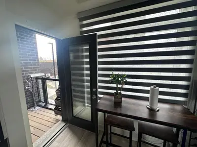 a dining room with a table and a window at 2bedroom Townhome in South Richmond Hill in Richmond Hill