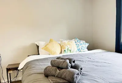 a stuffed animal on a bed in a bedroom at Canada WonderLand Stay-Superb Location in Vaughan