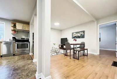 a kitchen and dining room with a table and chairs at Canada WonderLand Stay-Superb Location in Vaughan