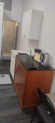 a kitchen with a sink and a counter top at Sartawi Place -Studio at Georgian Bay in Waubaushene