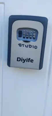 a close up of a digital clock on a refrigerator at Sartawi Place -Studio at Georgian Bay in Waubaushene