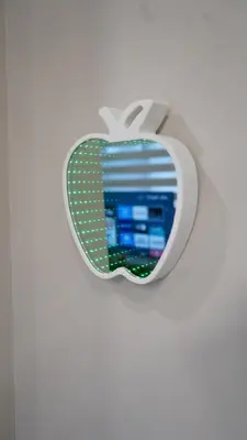 an apple logo on a white wall at Stunning fully furnished detached house 4 Bed Retreat, with complete privacy and comfort, WiFi & Full Kitchen in Paris