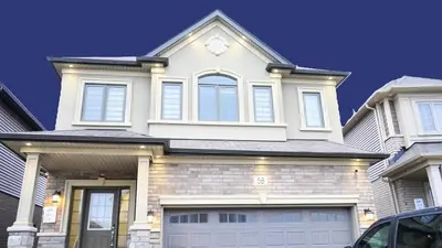 a white house with a clock on top of it at Stunning fully furnished detached house 4 Bed Retreat, with complete privacy and comfort, WiFi & Full Kitchen in Paris