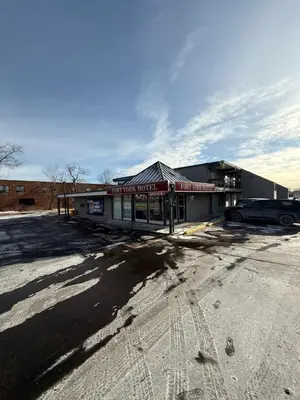 an empty parking lot in front of a building at Fort York Motel in Mississauga