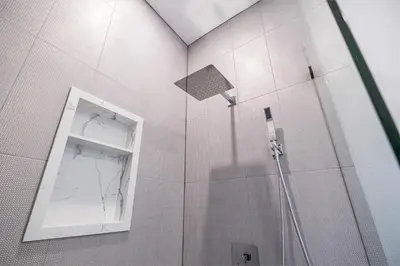 a bathroom with a shower with a mirror and a window at Adorable Modern Master Bedroom near Colleges and K-town in Toronto
