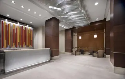 a lobby with a waiting room with tables and chairs at Cozy Ensuite private room homestay in Mississauga
