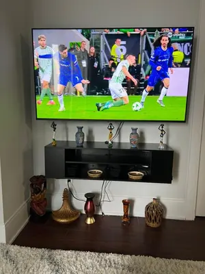 a flat screen tv hanging on a wall at Cozy Ensuite private room homestay in Mississauga