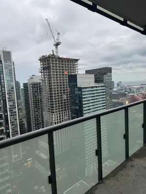 a view of a city skyline from a building at Cozy 1 Bedroom Downtown in Toronto