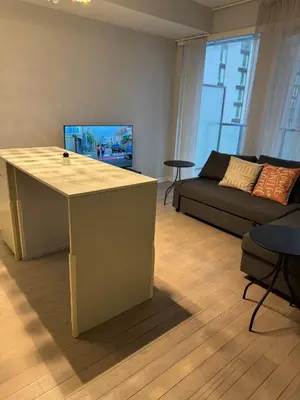 a living room with a couch and a table in it at Cozy 1 Bedroom Downtown in Toronto