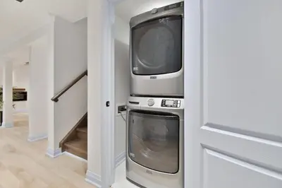 two microwaves sitting on top of a washer and dryer at Pinnacle of Luxury & Leisure- 2 BDM,2 BATH, KITCHEN in Whitby