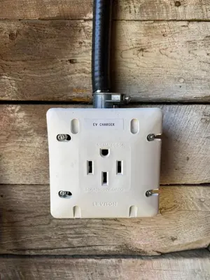 an electrical outlet on top of a wooden wall at Spacious Beach Town Retreat - Sleeps 8 in Port Elgin