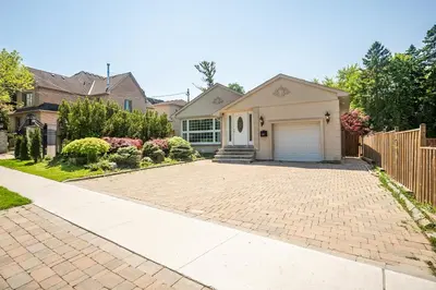 a house with a driveway and a garage at 3 Bedroom Luxury House in Toronto in Toronto