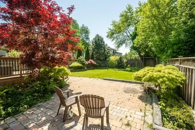 two chairs and a table on a brick patio at 3 Bedroom Luxury House in Toronto in Toronto