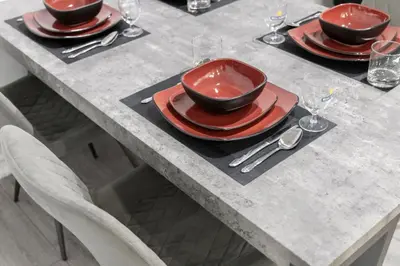 a table with red plates and a bowl on top at Modern 1BR and 1BA condo near Downtown with City Views in Toronto