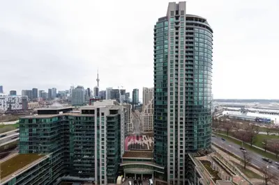 a view of a city skyline with tall buildings at Chic 1BR Condo Lake and City Views plus Free Parking in Toronto