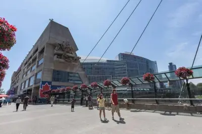 a group of people standing in front of a building at Chic 1BR Condo Lake and City Views plus Free Parking in Toronto