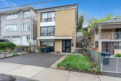 an empty driveway in front of a house at Cozy 2BR Home with Workspace Toronto Retreat in Toronto