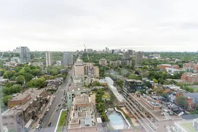 an aerial view of a city street with buildings at Chic 1BR plus Den Condo Near ROM and CN Tower in Toronto