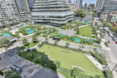 an aerial view of a park in a city at Cozy 1BR Condo with Balcony and Parking in Toronto