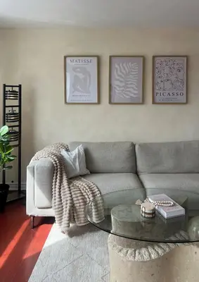 a living room with a couch and a coffee table at Cozy Bohemian Apartment in Toronto