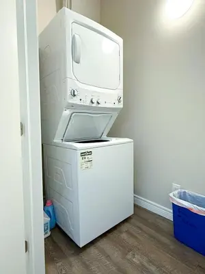 a white washer and dryer in a room at Contemporary East Loft in Historic Niagara in Niagara on the Lake