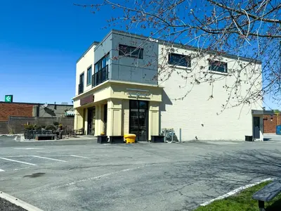 an empty parking lot in front of a building at Contemporary East Loft in Historic Niagara in Niagara on the Lake