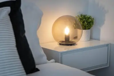 a candle on a night stand next to a bed at Executive 1BR-1BA Condo in the heart of downtown in Toronto