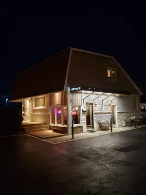 a building with a store front at night at Holiday Home 7865LL in Niagara Falls