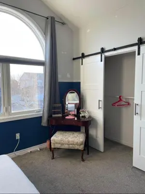 a bedroom with a desk and a window and a mirror at Serene Bedroom with Private Ensuite in Georgina