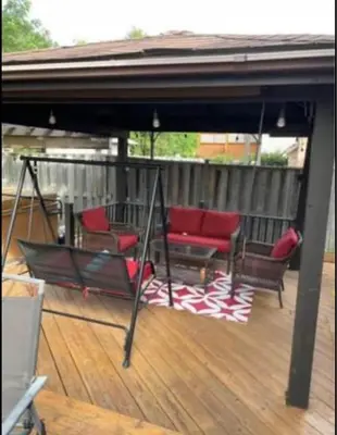 a porch with chairs and a hammock on a deck at Serene Bedroom with Private Ensuite in Georgina