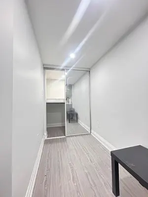 an empty room with a table and a mirror at The Sleek Shelter in Milton