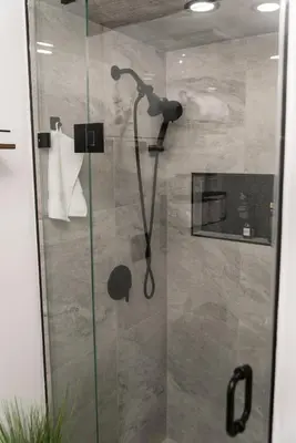 a shower with a shower head in a bathroom at Luxurious Home Away From Home in Pickering