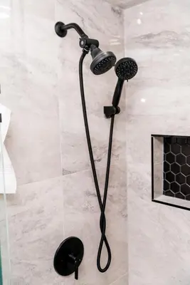 a shower with a black shower head in a bathroom at Luxurious Home Away From Home in Pickering