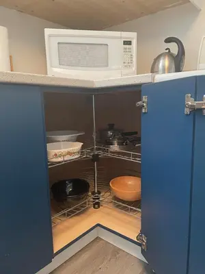 a microwave oven sitting on top of a kitchen cabinet at Entire Apartment in Guelph