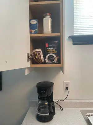 a coffee maker sitting on a counter in a kitchen at Entire Apartment in Guelph