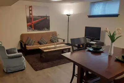 a living room with a couch and a table at Entire Apartment in Guelph