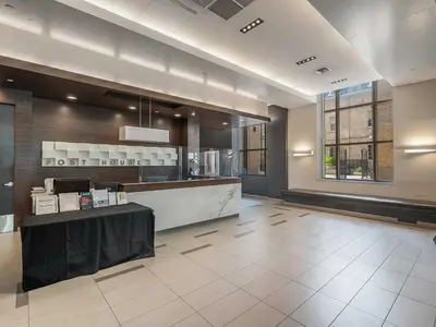 a lobby of a hotel with a reception desk at Prime Downtown Condo - St Lawrence Parking in Toronto
