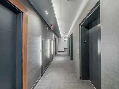 a hallway of an office building with a long corridor at Prime Downtown Condo - St Lawrence Parking in Toronto