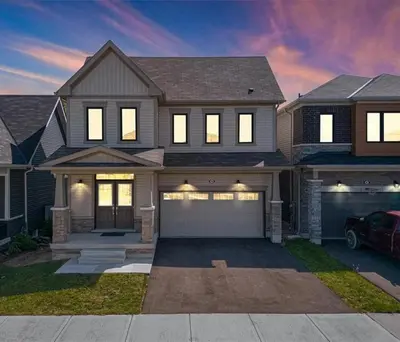 a house with a car parked in front of it at Classy Home Near Beach & Airport in Hagersville