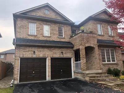 a brick house with two garage doors at 2 Bed-2Bath-Kitchen Private Family Couple Work in Newmarket
